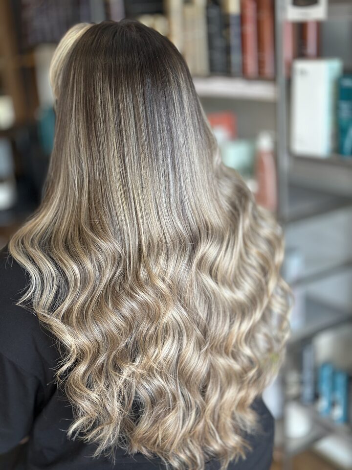 Soft ashy balayage with waves after the treatment