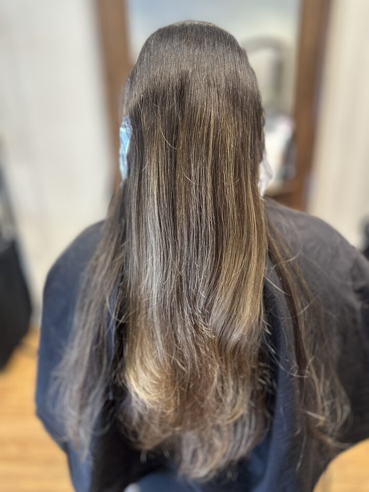 Long hair with dark regrowth and dull lengths before the balayage