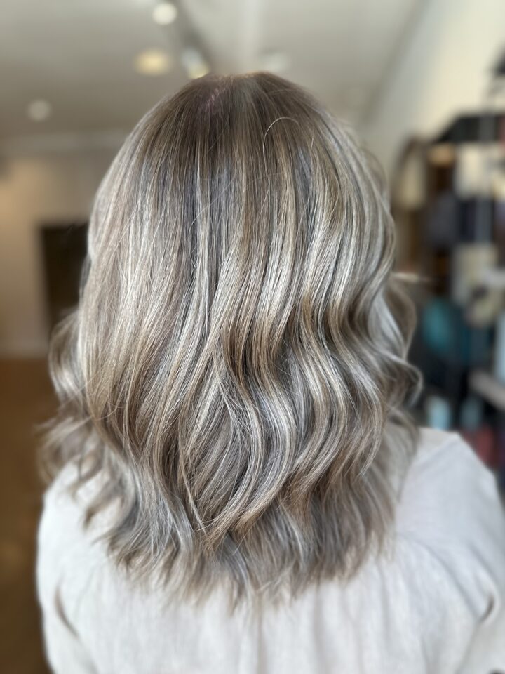 Ashy blonde bob with soft highlights, seen from behind