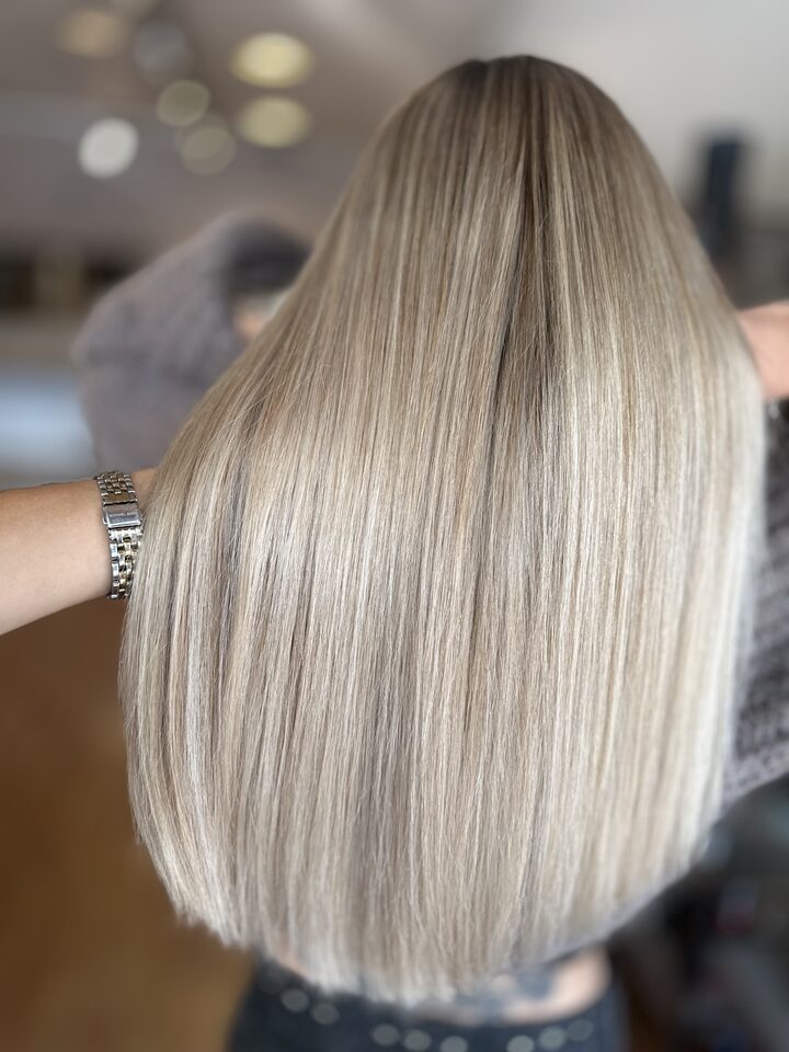 Ashy blonde after highlights and toning, seen from behind