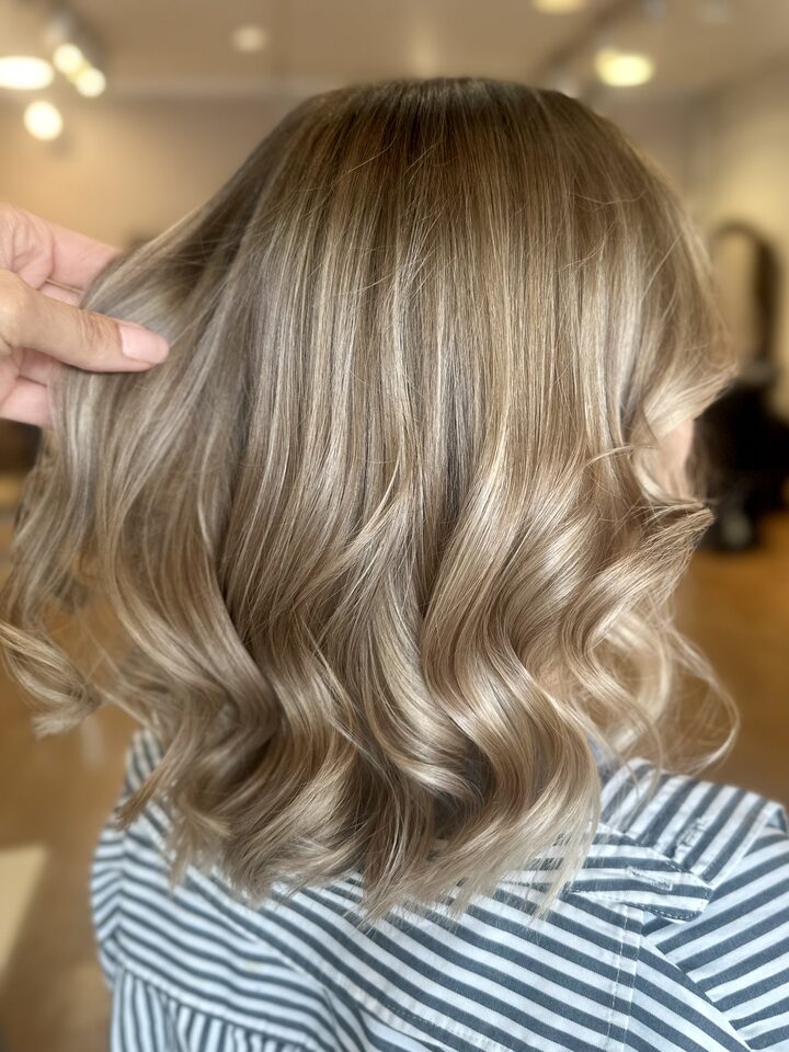 Light soft balayage with soft waves after the treatment