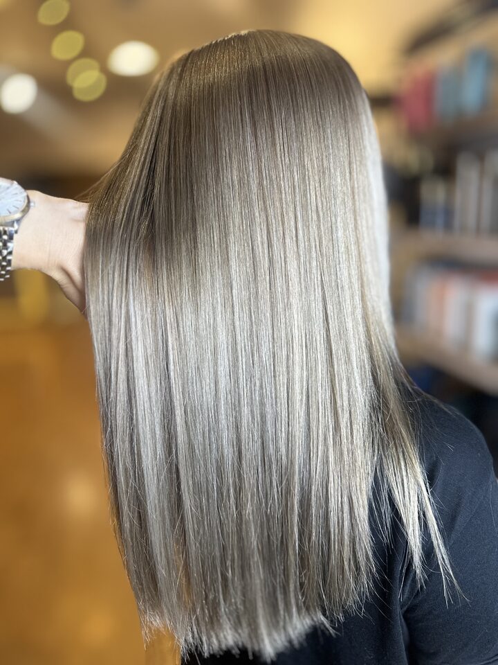 Cool silver blonde after lightening and toning, seen from behind